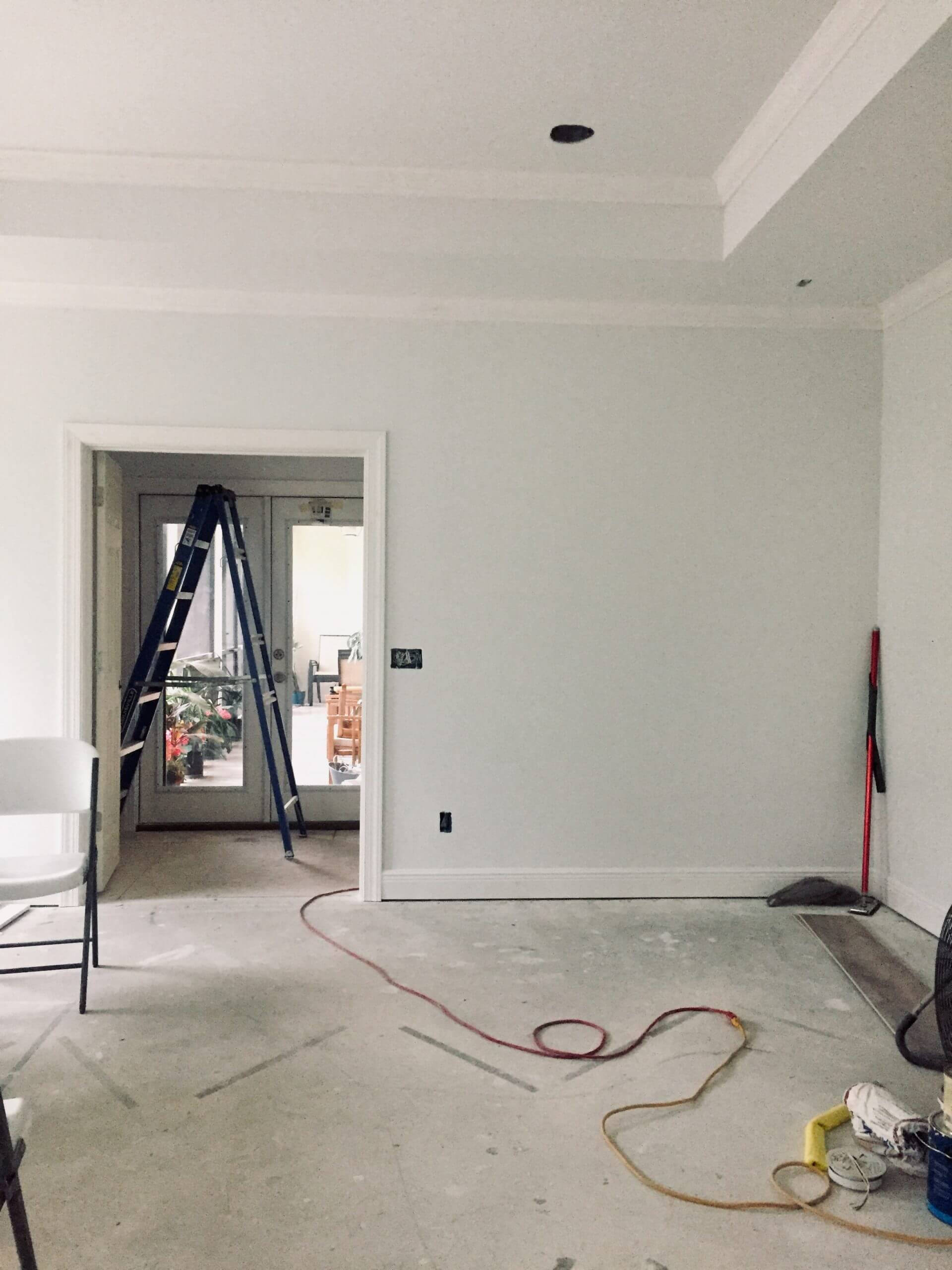 Post hurricane, master bedroom remodel with unfinished drywall, trim, and flooring