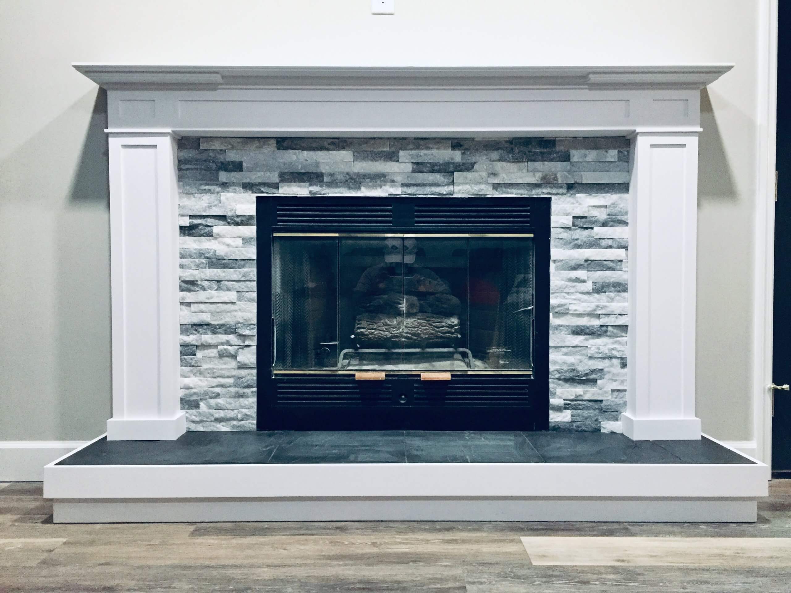 Custom fireplace remodel with mantel and hearth